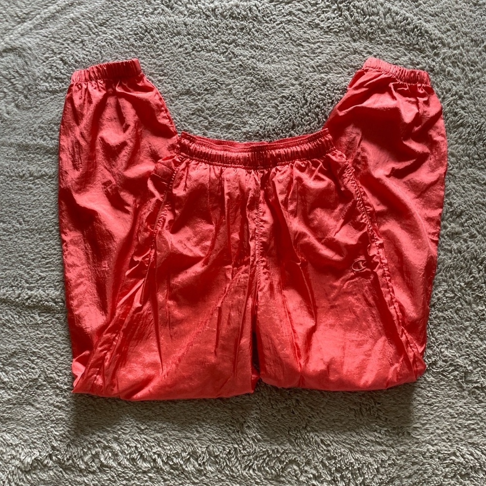 Orange/red deadstock Champion track pants with drawstring and pockets